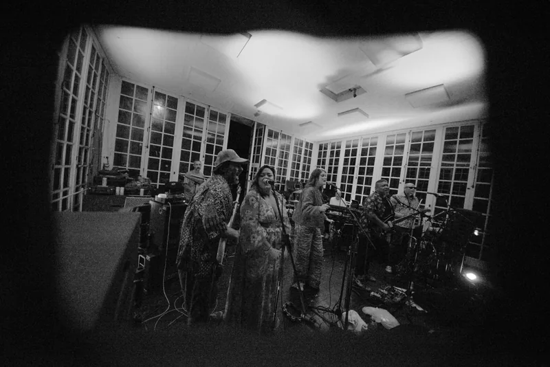 The CJP Band rehearsing — singer and bass player
